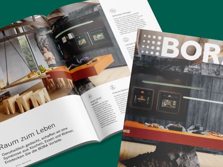 Cover of BORA Magazine issue 2025 next to an open double page spread showing a modern kitchen with cooking area