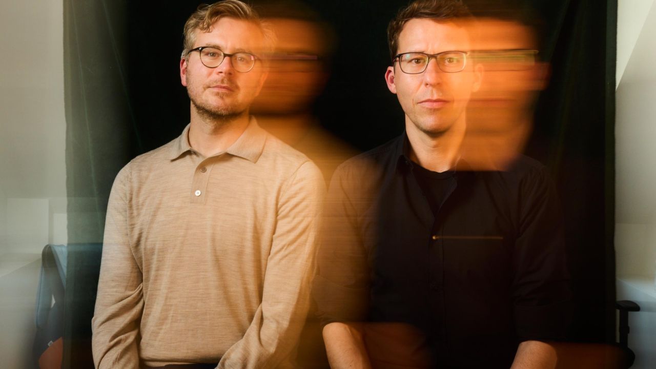 Double portrait of two men, in which movement and blurring are created by long exposure Double portrait of two men, in which movement and blurring are created by long exposure
